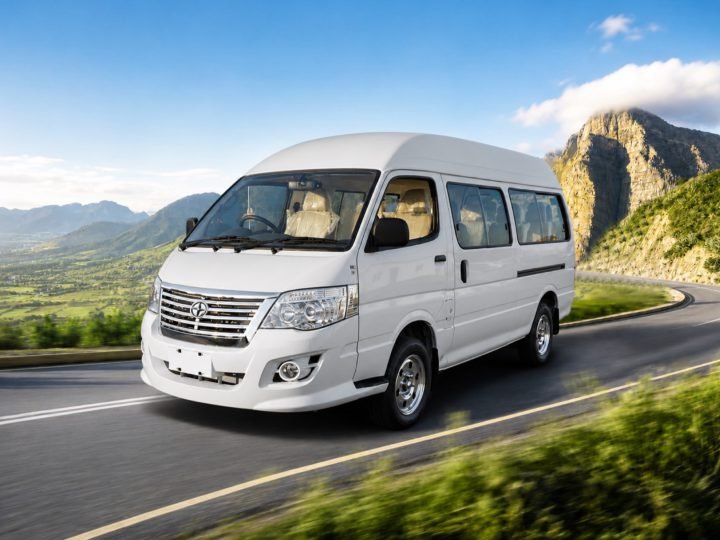 White electric van on a mountain road